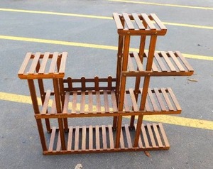 lot 8 image: Tiered Plant Stand With Wooden Stand Base