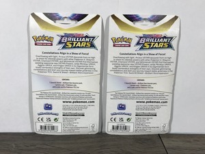 lot 11 image: POKEMON BRILLIANT STARS Flapple & Eevee Booster Packs (2 - Unopened packs with coin in the front)