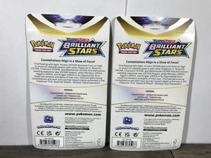 lot 15 image: POKEMON BRILLIANT STARS Flapple Booster Packs (2 - Unopened packs with coin in the front)