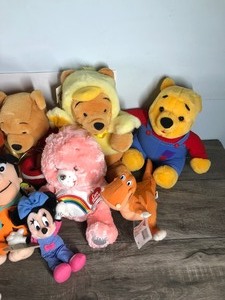 lot 80 image: Lot of Plush Toys - Vintage Bambi - Scooby Doo - Raggedy Ann - Mickey Mouse - Winnie the Pooh - Garfield - Flinstones and More