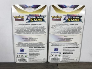 lot 122 image: POKEMON BRILLIANT STARS Flapple Booster Packs (2 - Unopened packs with coin in the front)