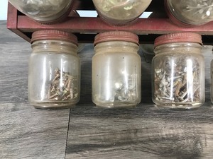 lot 354 image: Vintage hardware storage spinning jars with hardware in the jars