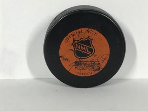 lot 432 image: North Stars Hockey Puck Signed by Steve Jensen