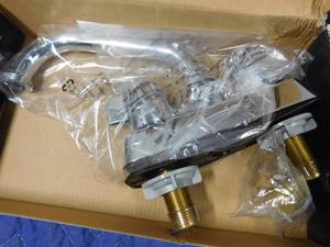 lot 276 image: New laundry faucet and non-programmable thermostat