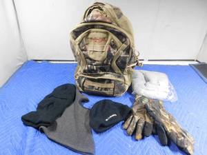 lot 226 image: Camouflage backpack and gloves, ski masks, hat and new foot warmer