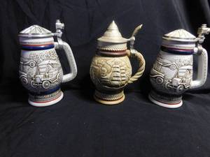lot 192 image: Late 70s Handcrafted numbered Avon steins.