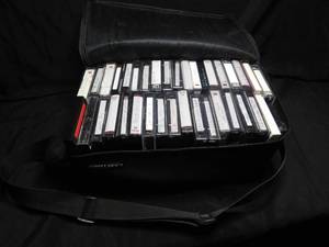 lot 300 image: Double sided cassette case full of cassettes and movie camera tapes