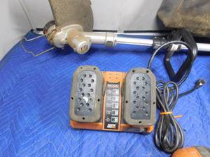 lot 343 image: Rigid battery operated power tools, charger and bag and black& Decker weed wacker w no battery