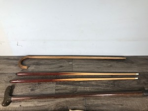 lot 497 image: 2 Canes - 2 Small Pool Sticks - 1 Plastic Long Bow