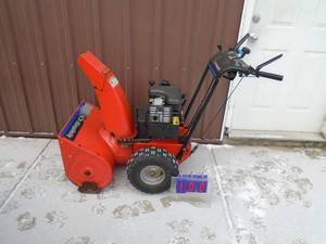 lot 100 image: Simplicity 722 snow blower. Used condition. Tested & works. As shown.