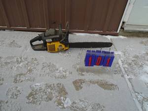 lot 101 image: McCullough 2318 chainsaw with 16 blade. Used condition. Fires on ether. As shown.