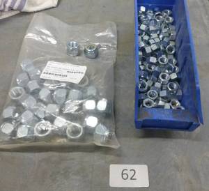 Bin of 38 nuts and bag of 34-10 nylok nuts