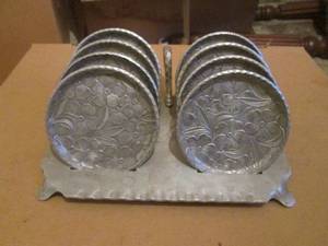 (R1) Vintage Everlast Forged Aluminum 8 Floral Coasters and Finger Loop Stand Set
