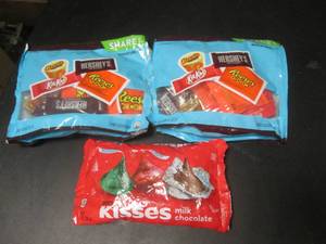 lot 153 image: 3 Bags of Candy 2 Share Pack Miniatures and 1 Bag Hersheys Kisses Best by March 2024