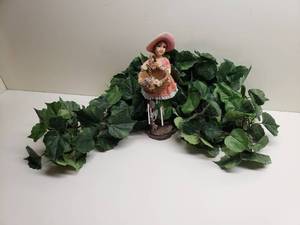 lot 146 image: Faux Leaves and Girl Figurine