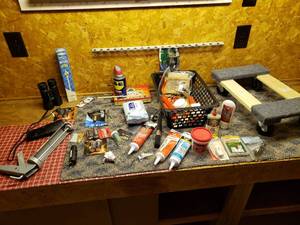 lot 150 image: Caulk, Batteries, Binoculars and More