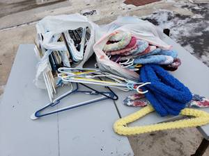 Clothes Hangers, some with Yarn Covers