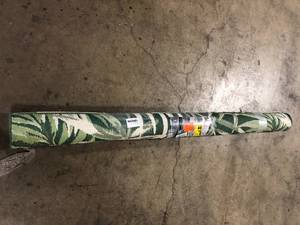 lot 34 image: Hampton Bay Green 7 ft. x 9 ft. Palm IndoorOutdoor Patio Area Rug     Customer Returns See Pictures