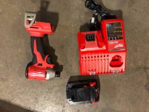 lot 35 image: Milwaukee M18 18-Volt Lithium-Ion Compact Brushless Cordless 14 in. Impact Driver Kit with One 2.0 Ah Battery, Charger & Tool Bag Customer Returns See Pictures
