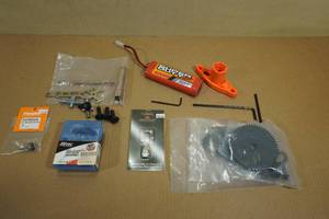 lot 4 image: Assorted RC Vehicle Parts - Servos, Switch, Tools