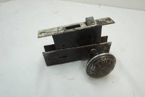 lot 84 image: Antique door knob and latch assembly