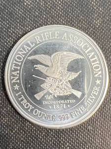 lot 49 image: 1 TROY OZ .999 FINE SILVER NATIONAL RIFLE ASSOCIATION ROUND