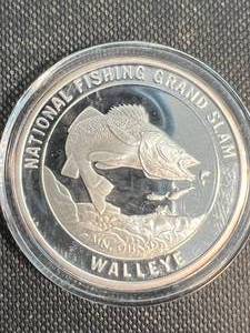 lot 50 image: 1 TROY OZ .999 FINE SILVER AMERICAN FISHING CLUB ROUND IN AIRTITE
