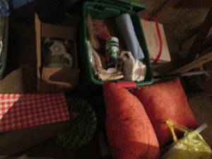 lot 138 image: Covered tote with placemats, cups and other kitchen plus a covered tote of accent pillows and a coffee server