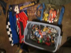 lot 140 image: Covered tote with sports relayed slippers, blanket and misc toys