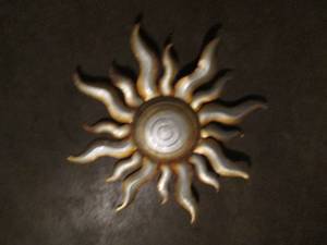 lot 70 image: 24 metal faceless Sun outdoor decor