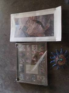 lot 77 image: Collage style photo frame, eagle print and decorative ceramic sun decor