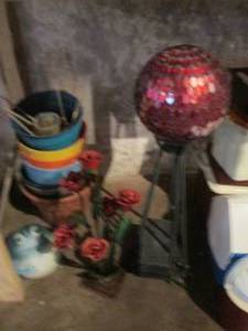 lot 82 image: Decorative outdoor orb with pedestal metal base, metal rose decor, frog and collection of colorful planters