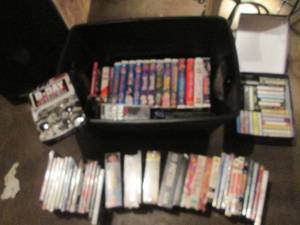 lot 83 image: Covered tote with a collection of Vintage VHS & DVD Movies along with cassette tapes
