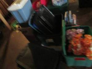 lot 96 image: Faux floral decor in watering can planters plus an assortment of empty totes and garbage cans