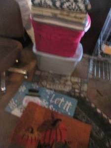 lot 104 image: Large assortment of entry rugs and floor mats contained in and around (2) covered totes