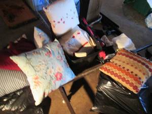 lot 106 image: Mountain of decorative accent pillows, lace doilie Mats and some bedding