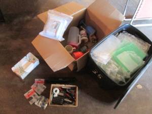 lot 111 image: Covered tote fill of assorted bubble wrap and a box of misc kitchen and office supplies