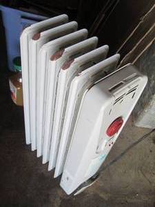 lot 115 image: Coil radiator style space heater
