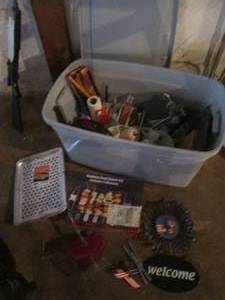 lot 122 image: Covered tote full of outdoor cooking supplies and decor