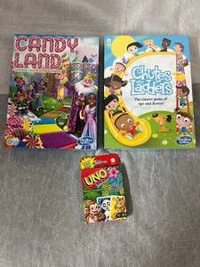 lot 26 image: Candy Land, Chutes & Ladder, and UNO