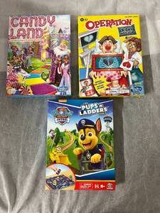 lot 27 image: Candy Land, Operation, and Paw Patrol Pups & Ladders