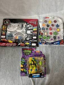 lot 33 image: Marvel Erasers, Cars Coloring Set, and Ninja Turtles Toy