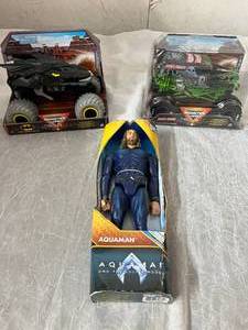 lot 34 image: Batman and Grave Digger Monster Truck and Aquaman Action Figure
