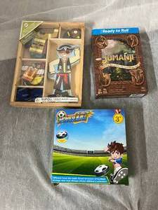 lot 39 image: Jumanji, Hover Soccer Ball, and Magnectic Boy Doll