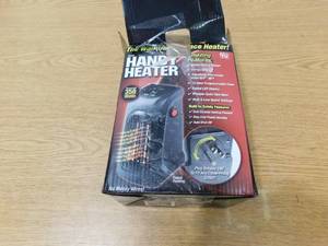 lot 57 image: 350-Watt Wall Outlet Handy Heater