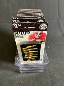 lot 136 image: Halloween Glitter Makeup Sticks - 12-Pack