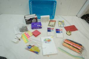 lot 26 image: Blue Basket with office supplies