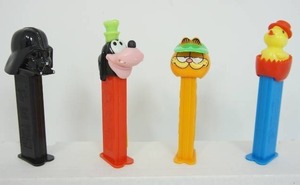 lot 46 image: Vintage Collectible Toy Pez Dispensers Including Goofy Green Hat Austria, Star Wars Darth Vader, Garfield with Green Hat Orange Feet, 1990s Hungary Easter Chick...