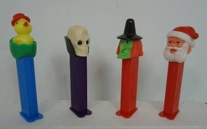 lot 50 image: Vintage Collectible Toy Pez Dispensers Including 1970s Dr. Skull Skeleton Halloween, 1970s Green Witch Austria, 1990s Hungary Easter Chick, Santa Claus wFeet...