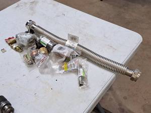 lot 154 image: Misc. Fittings, Attachments and Connectors - Eastman Waterflex Stainless Steel Water SoftenerBoiler Connection , Tomahawk Brass Pipe 12x2, Watts Red Brass Pipe Tee Connector 1 FIP, and more